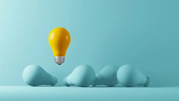 Light bulb yellow floating outstanding among lightbulb light blue on background. Concept of creative idea and innovation, Unique, Think different, Individual and standing out from the crowd. 3d illustration