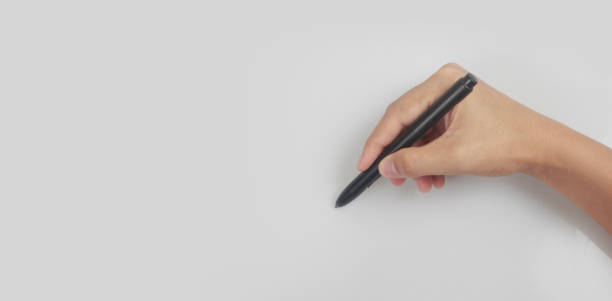 istock Hand ready for drawing with black marker 1325159853