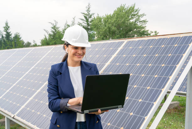 istock A Female Manager Engineer İn Safety Helmet Checking With Tablet An Operation Of Solar Panel System At Solar Station 1325161604