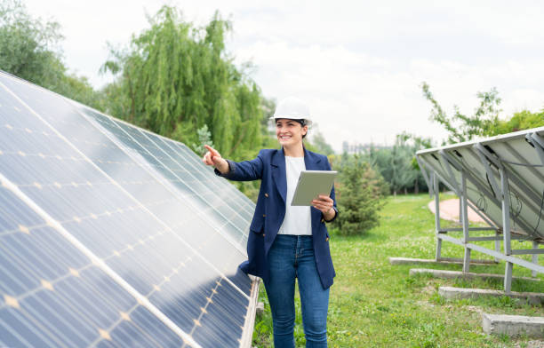 istock A Female Manager Engineer İn Safety Helmet Checking With Tablet An Operation Of Solar Panel System At Solar Station 1325161697
