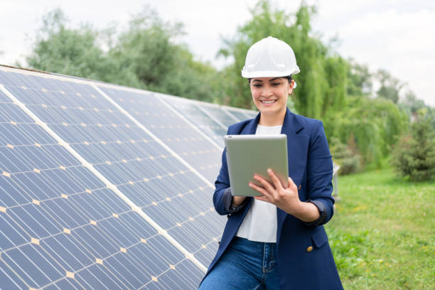 istock A Female Manager Engineer İn Safety Helmet Checking With Tablet An Operation Of Solar Panel System At Solar Station 1325161747