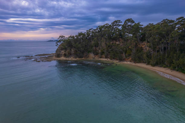 istock Cloud covered aerial sunrise seascape over the cove 1325162733
