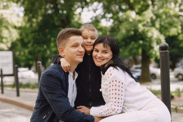 istock Cute family playing in a summer park 1325164701