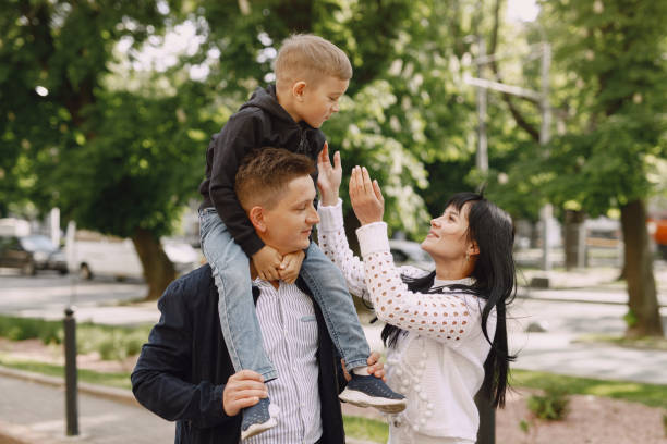istock Cute family playing in a summer park 1325164704