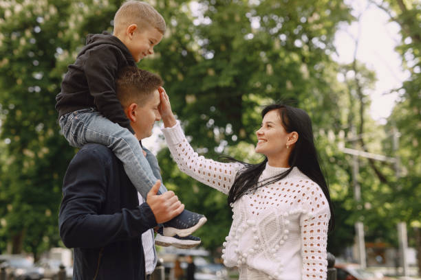 istock Cute family playing in a summer park 1325164718
