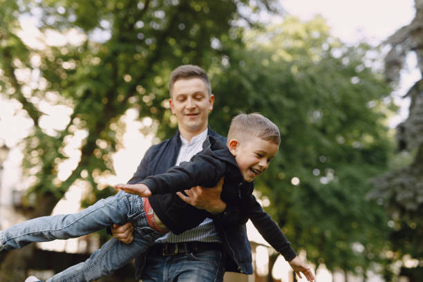 istock Cute family playing in a summer park 1325164826