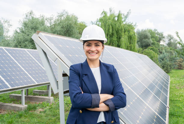 istock A Female Manager Engineer İn Safety Helmet At Solar Station 1325165526