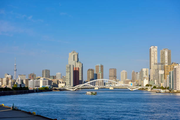 Tokyo Bay waterfront area. Scenery of Tokyo, Sumida River, Tsukiji Ohashi (bridge) and buildings.