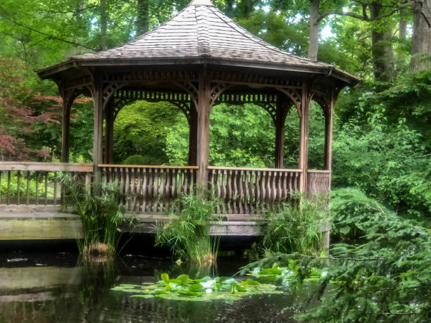 istock Wooden octagon shaped gazebo by water 1325168770