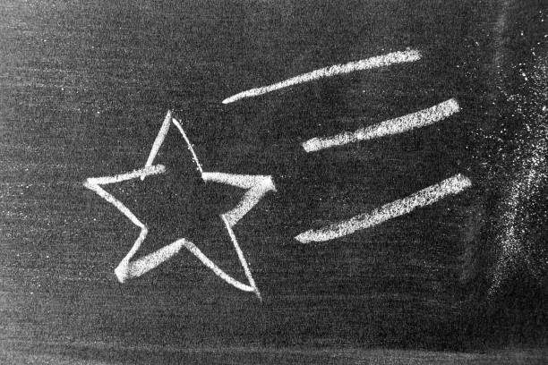istock White color chalk hand drawing as star shape on blackboard or chalkboard background 1325168931