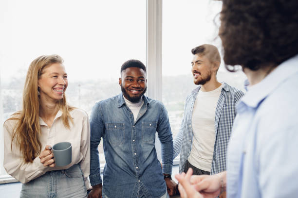 istock Cheerful young business people have a talk during coffee break in office 1325169879