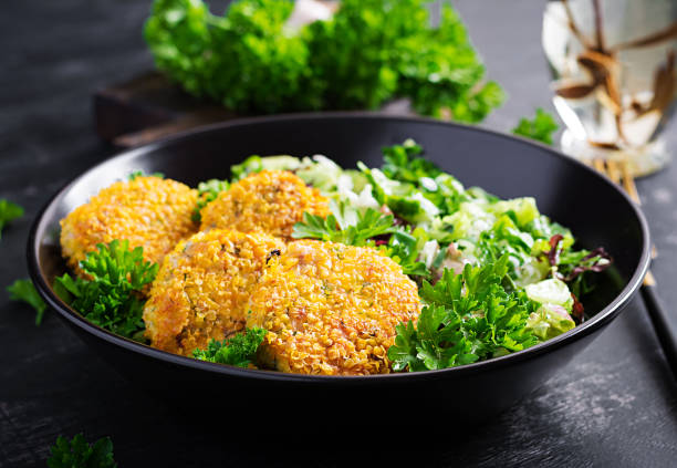 istock Homemade fish croquettes from white fish in cornflakes breading. Fritters from minced cod. Delicious and nutritious lunch or dinner. 1325171875