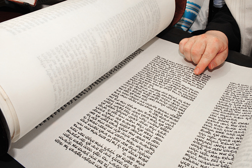 Jewish orthodox man reading from a Torah scroll.first five books of the Hebrew Bible, namely Genesis, Exodus, Leviticus, Numbers and Deuteronomy. This is known in the Jewish tradition as the Written Torah.