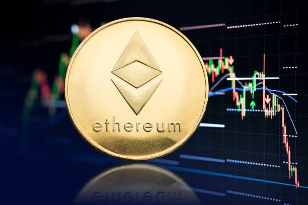 Ethereum coin and stock chart at background Galicia, Spain; April 19, 2021: Ethereum coin and stock chart background with price falling. Cryptocurrency ethereum stock pictures, royalty-free photos & images