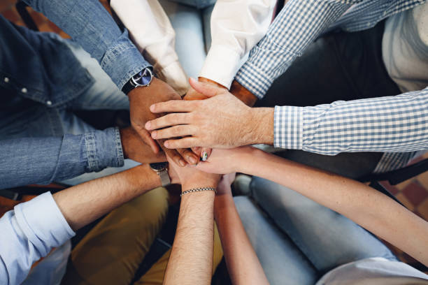 istock Top view of diverse people hands holding together in circle, hands stack 1325174592