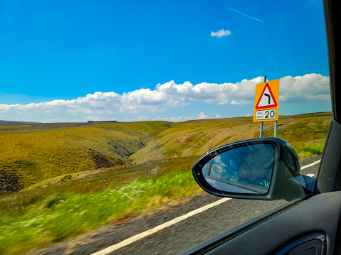 View over the North Pennines from the A 69 in Cumbria.  There are blue summer skies in the background.