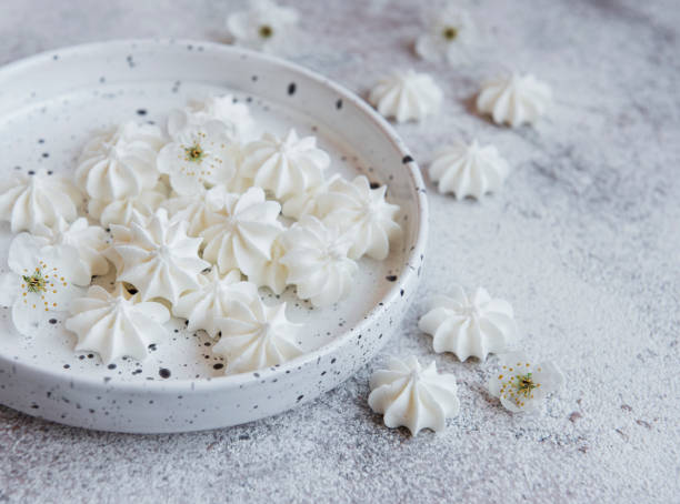 istock Small white meringues in the  ceramic bowl 1325175832