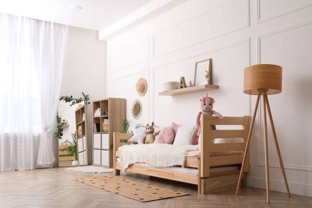 istock Cute child's room interior with comfortable bed and toys 1325180918