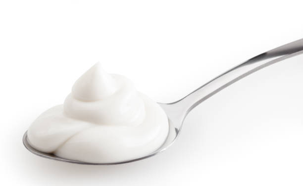 istock Spoon of mayonnaise isolated on white background with clipping path 1325182089