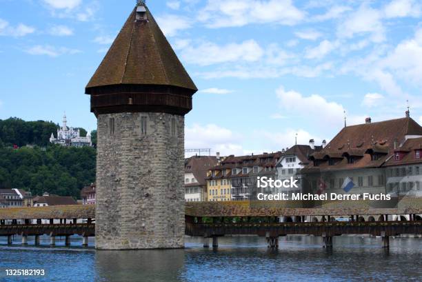 Famous Wooden Kappelbrücke At The Old Town Of Lucerne With Medieval Stone Tower With Wooden Roof Stock Photo - Download Image Now