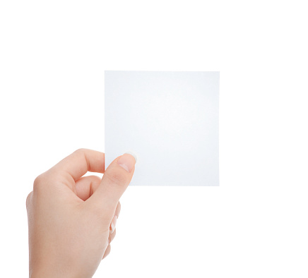 Woman's hand holding an empty square white blank note paper against white background
