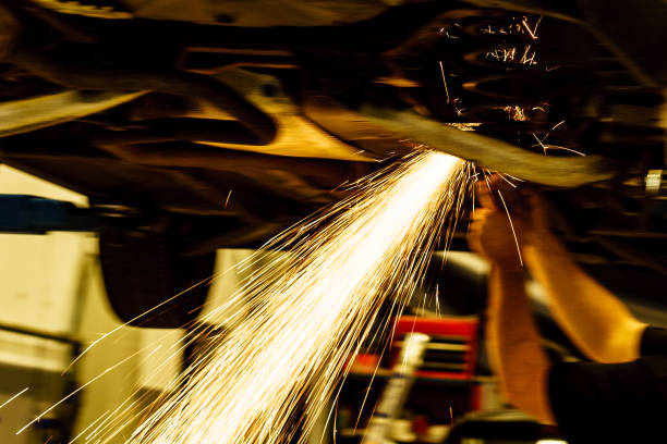 istock Mechanic grinding car body by grinder 1325182545