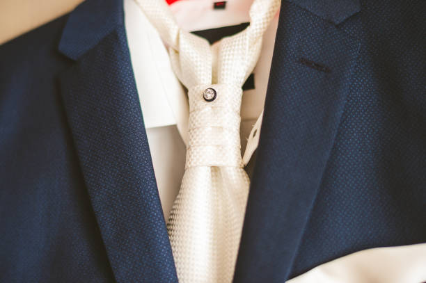 istock Groom suit and white tie on a hanger 1325182790