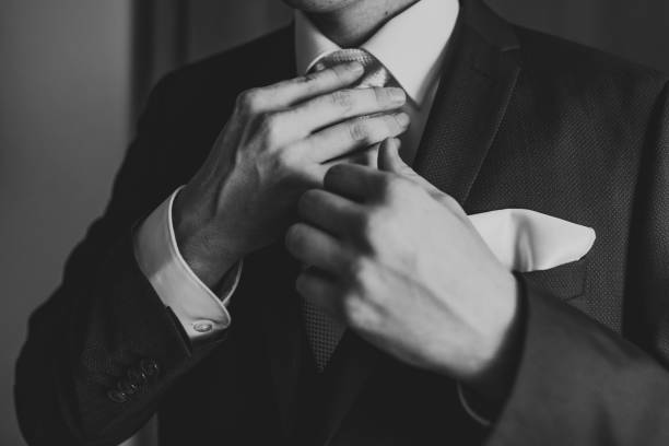 istock Businessman fixing his tie 1325182812