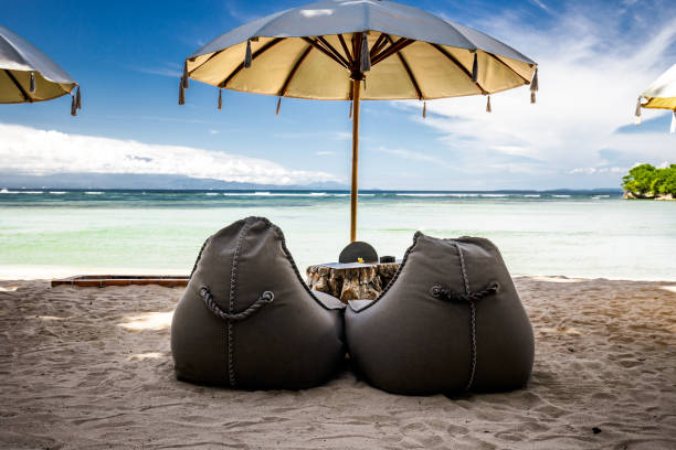 istock Bean bags and sun umbrellas on the beach. 1325186090