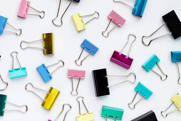 istock Colorful office paper clips on white background. 1325189825