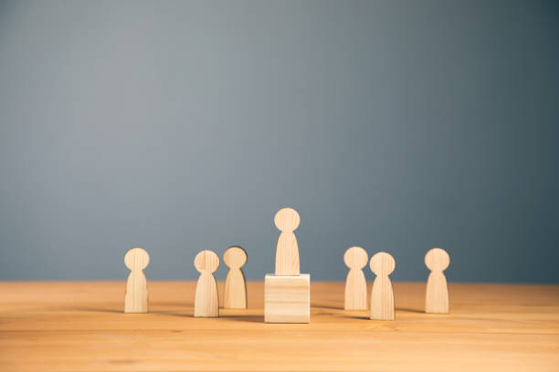 istock Teamwork and organization with wooden figures 1325190423