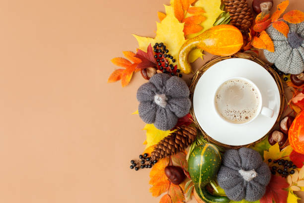 istock Autumn flat lay composition with dry leaves wreath frame and coffee latte cup on neutral beige background. Creative autumn, thanksgiving, fall, halloween concept. Top view, copy space, seasonal menu 1325192600