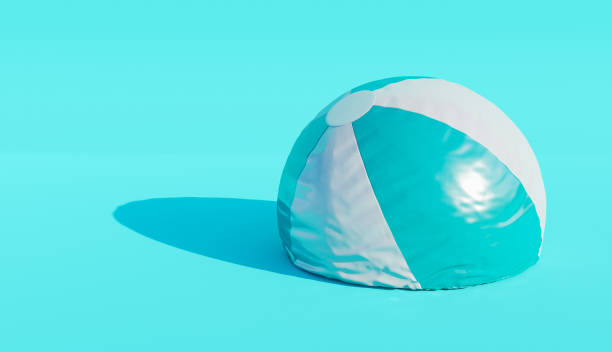 deflated beach ball deflated beach ball on blue background. minimalistic scene. end of summer concept. 3d render deflated stock pictures, royalty-free photos & images