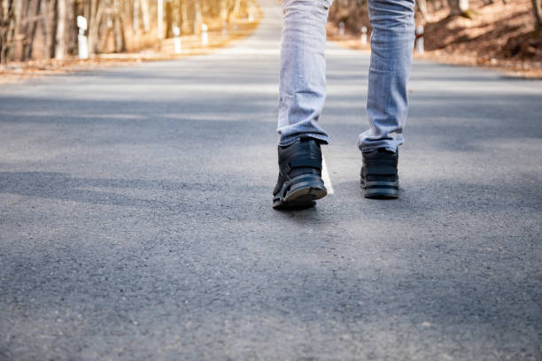 istock Man walking on the road 1325193358
