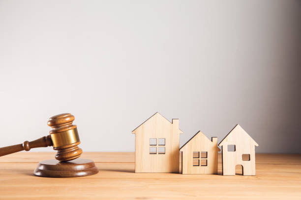 istock Judge hammer with wooden house model 1325193438