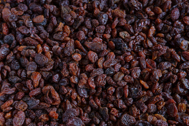 istock Background of scattered raisins. 1325193566