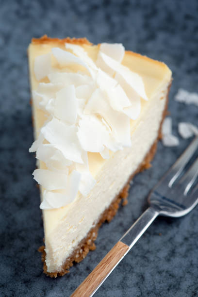 istock Slice of coconut cheesecake on plate 1325194172