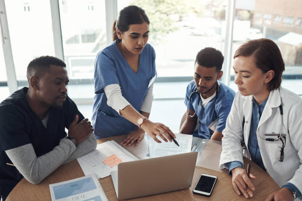 istock Shot a group of doctors discussing work matters in the office at work 1325195717