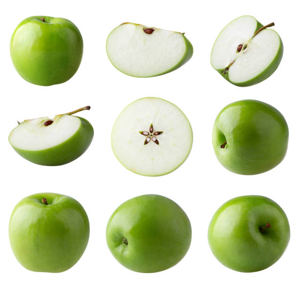 istock Green apple and cut slice with seed isolated on white background. 1325197070