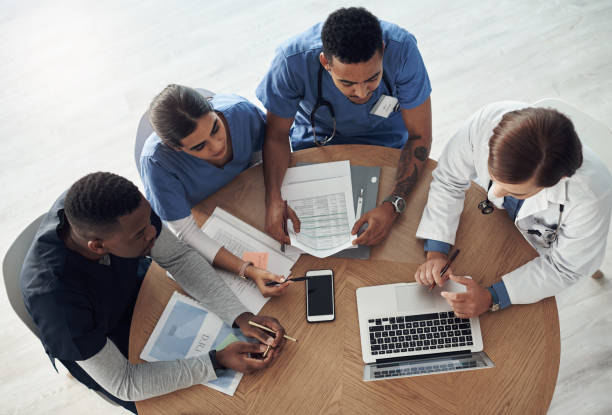 istock Shot a group of doctors discussing work matters in the office at work 1325198355
