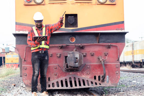 istock African engineer   control a the train on railway with using tablet and talking by radio communication or walkie talkie 1325198391
