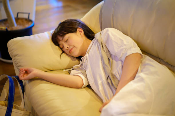 Young woman resting on the sofa in the evening