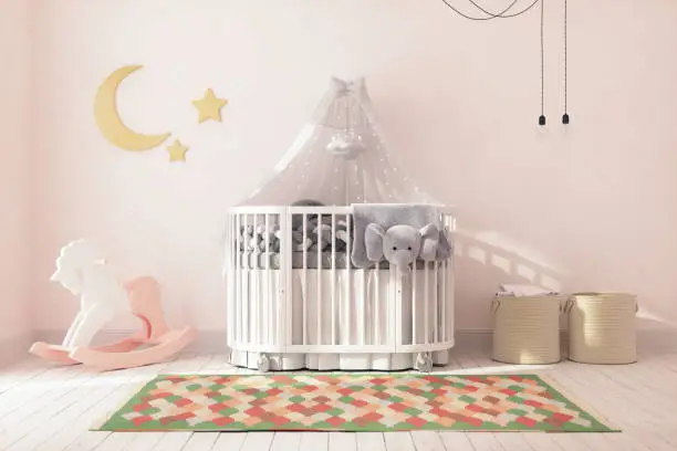 Empty crib in a nursery at home.