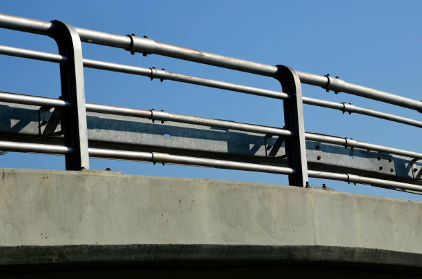 istock view of the highway overpass where the railing is formed by several railing pipes and barriers made of galvanic metal 1325199616
