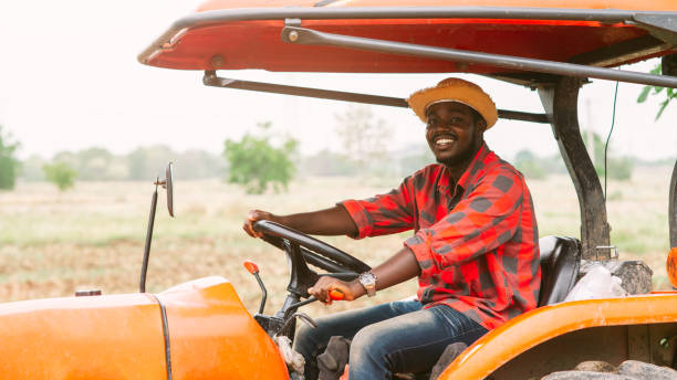 istock African man farmer working in the field with a tractor 1325200192