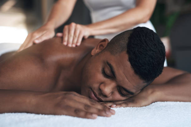 istock Shot of a young man getting a back massage at a spa 1325202756