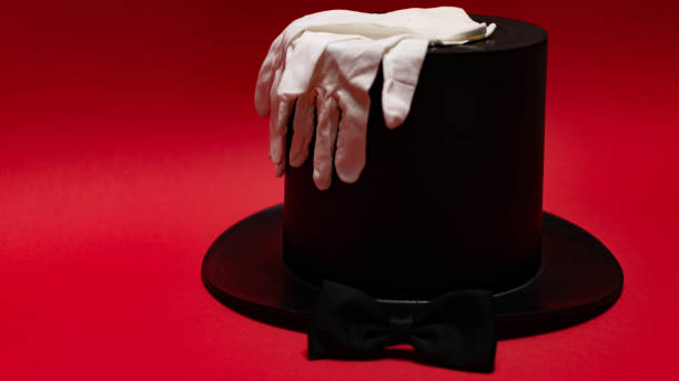 istock Gentleman's club, top hat, white gloves, bow tie, on a red background. 1325202972