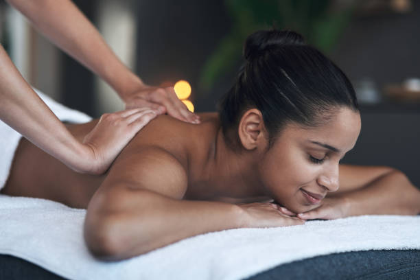istock Shot of a young woman getting a back massage at a spa 1325203032