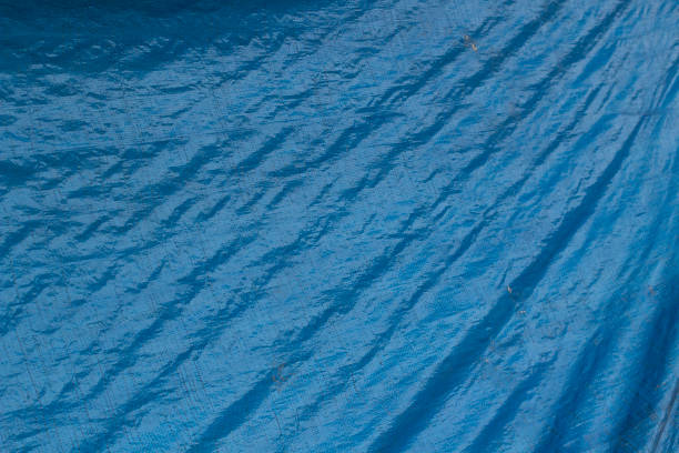istock Texture of a blue cloth bag. Blue plastic bag. Fine weave texture. 1325204026