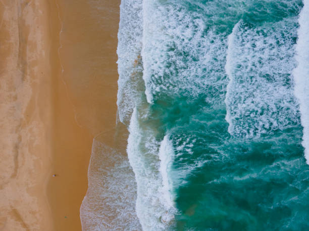 istock Close-up beach sand texture and sea water 1325204649